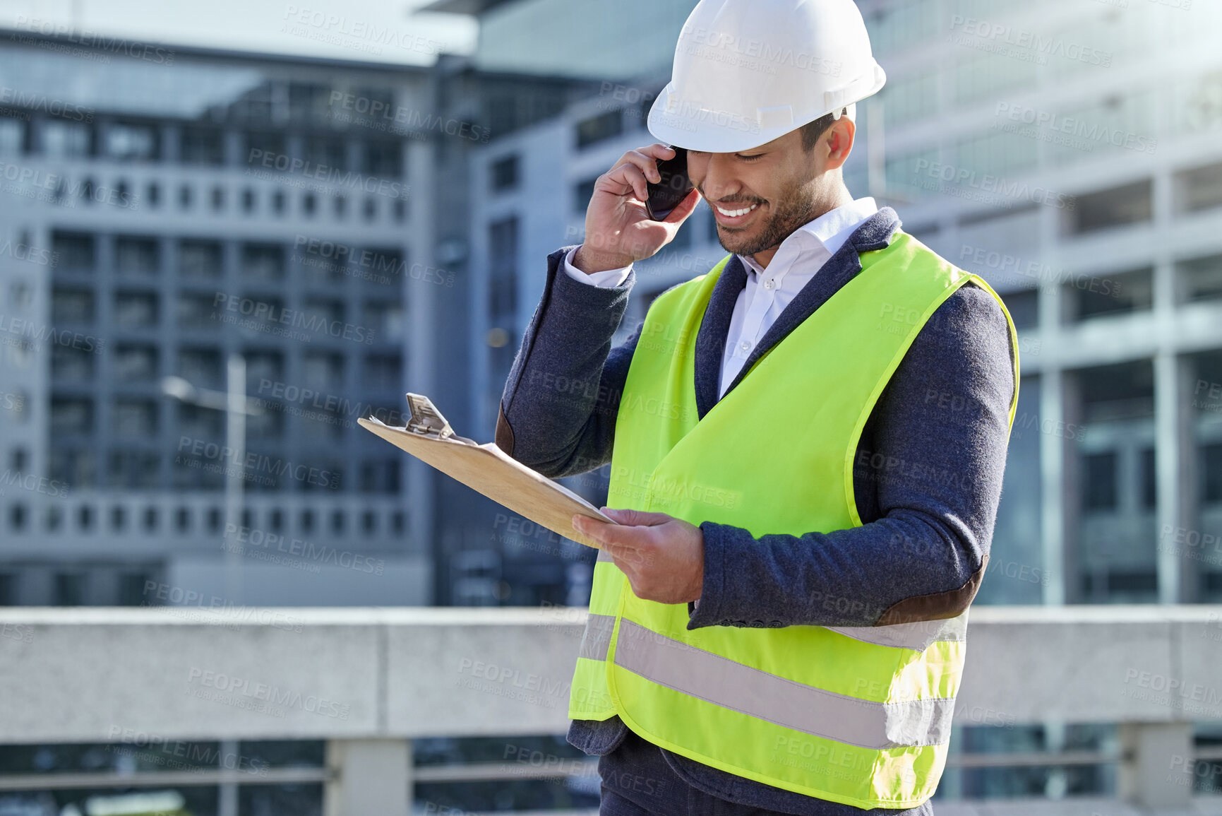 Buy stock photo Engineer, man and clipboard and call in construction site with cellphone, smile and confident. Male person, project manager and hardhat in Abu Dhabi for building, architecture and development in city
