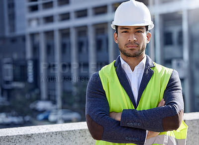 Buy stock photo Man, engineer and portrait and arms crossed in construction site with serious, face and confident. Male person, project management and hardhat in Dubai for building, architecture and development