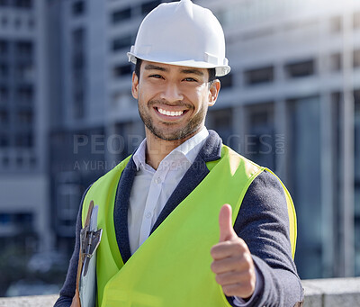 Buy stock photo Shot of a young businessman working on a construction site giving the thumbs up