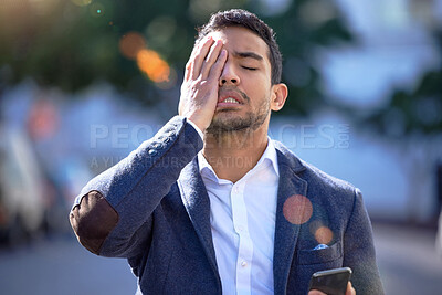 Buy stock photo Phone, frustrated and businessman with headache in city for career stress, financial crisis and bad news. Broker, anxiety and person with hand on face for and recession, issue and stock market crash