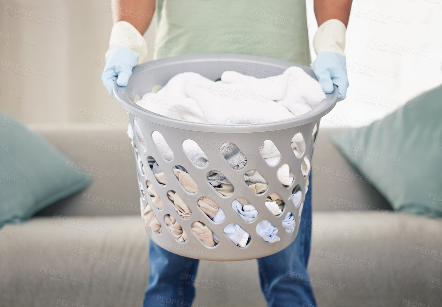 Buy stock photo Shot of a man holding a basket of laundry