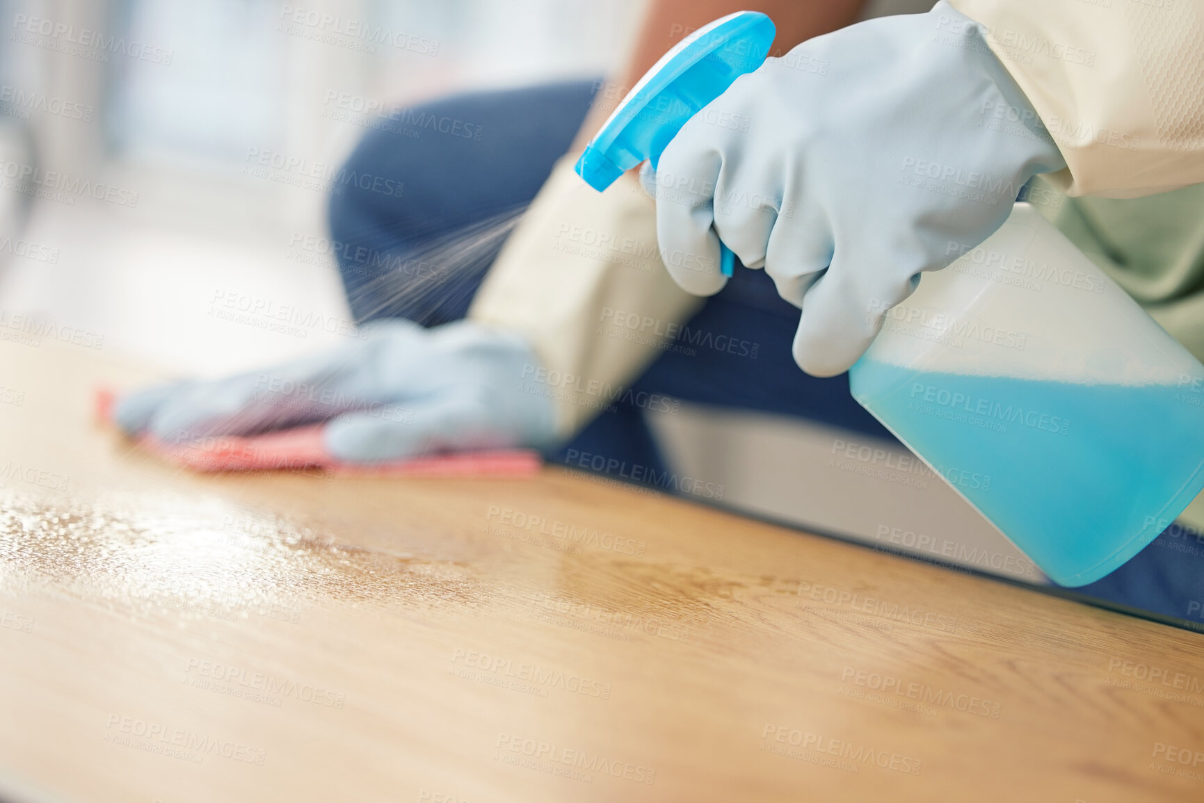 Buy stock photo Cleaning, hands in gloves and spray at table in living room of home for domestic chores or housework. Bacteria, bottle and product to wipe with person in apartment for disinfection or housekeeping