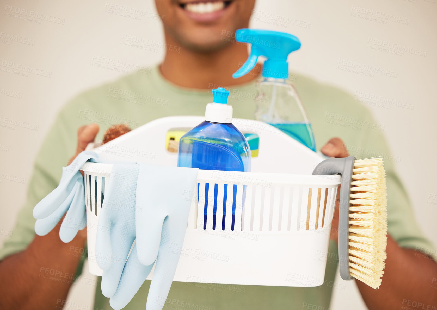 Buy stock photo Man, cleaning and closeup with gloves and basket in studio, container and soap for hygiene. Male cleaner or worker with chemical and cloth for washing, hospitality service on backdrop for career