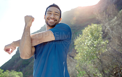 Buy stock photo Fitness, portrait and stretching with a man runner outdoor in the mountains for a cardio or endurance workout. Exercise, sports and smile with a young male athlete getting ready for a run in nature