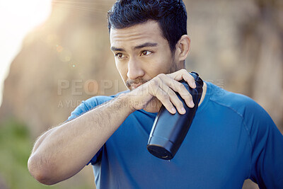 Buy stock photo Fitness, asian man and bottle for running, rest or fatigue in outdoor workout. Sport, drinking water and male athlete person wiping mouth for training, exercise or marathon trail in sunshine