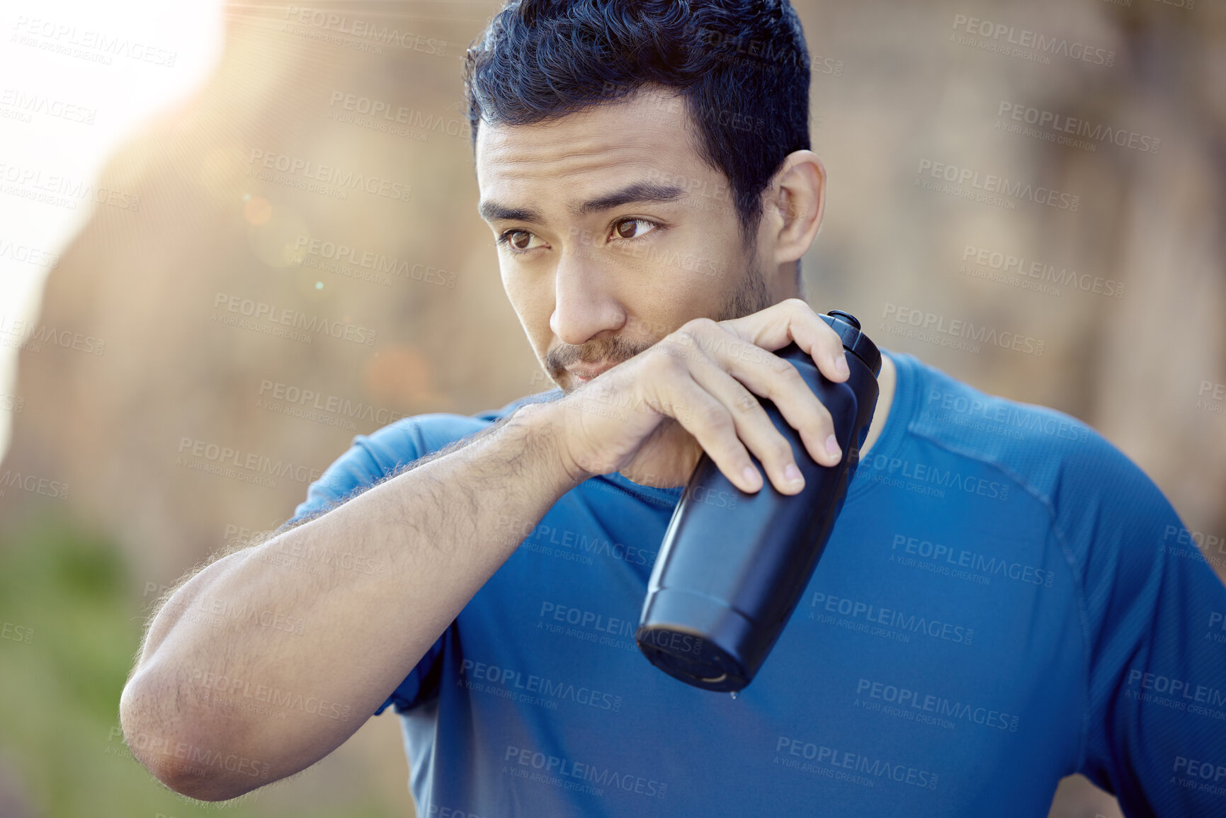 Buy stock photo Fitness, asian man and bottle for running, rest or fatigue in outdoor workout. Sport, drinking water and male athlete person wiping mouth for training, exercise or marathon trail in sunshine