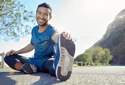 Buy stock photo Exercise, portrait and stretching with a man runner outdoor in the mountains for a cardio or endurance workout. Fitness, sports and smile with a young male athlete getting ready for a run in nature