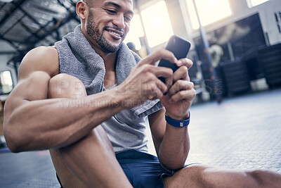 Buy stock photo Fitness, app and man in gym with phone to post progress of exercise, schedule and planning training. Happy, body builder and person reading smartphone with health info or track development in workout