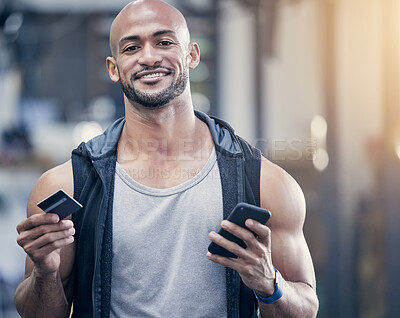 Buy stock photo Credit card, phone and portrait with bodybuilder man in gym for strength training or workout. Exercise, smile and wellness with happy athlete in health club for ecommerce or online shopping
