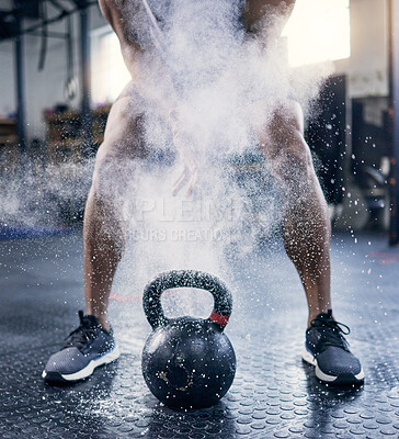 Buy stock photo Kettlebell, powder and legs of person for workout, exercise and development for sport. Bodybuilder, human and body of athlete with equipment at gym for wellness, training and healthy progress