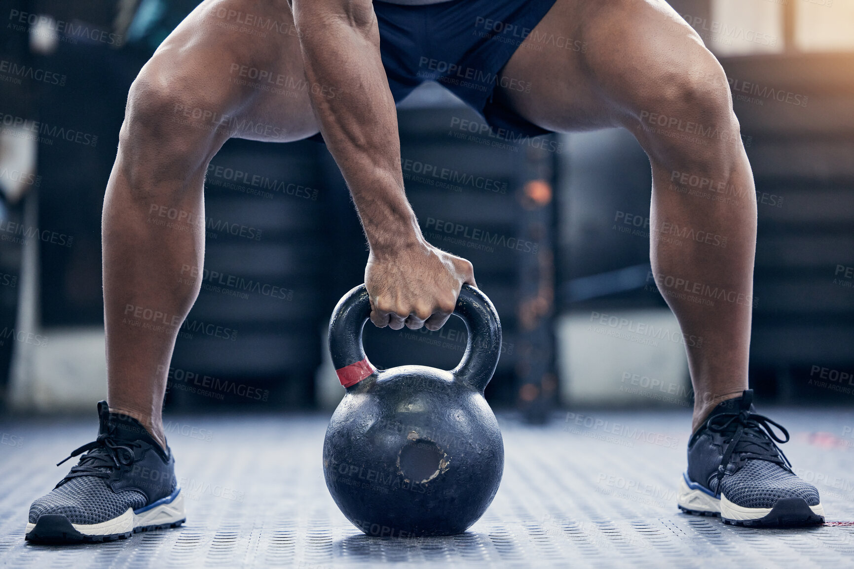 Buy stock photo Fitness, floor and kettlebell with a bodybuilder man in the gym for a weightlifting workout routine. Exercise, hand and strong with a male athlete holding a weight in a sports club while training