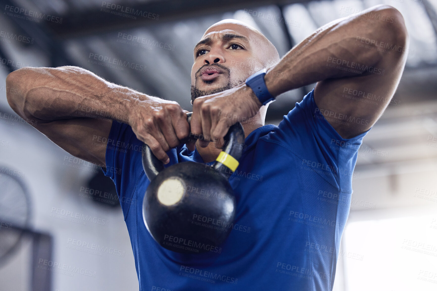 Buy stock photo Man, kettlebell or weight in gym for training, fitness and exercise to gain muscle for health, strength and wellness. Male person, bodybuilder or athlete lifting iron for workout, cardio and power