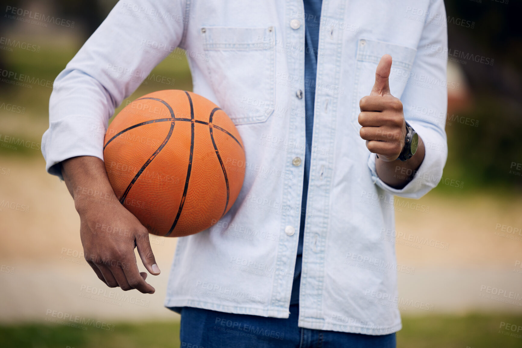 Buy stock photo Man, student and hands with basketball or thumbs up for winning, vote or review at unversity campus. Closeup of male person, athlete or player with like emoji, yes sign or OK in sports, game or match