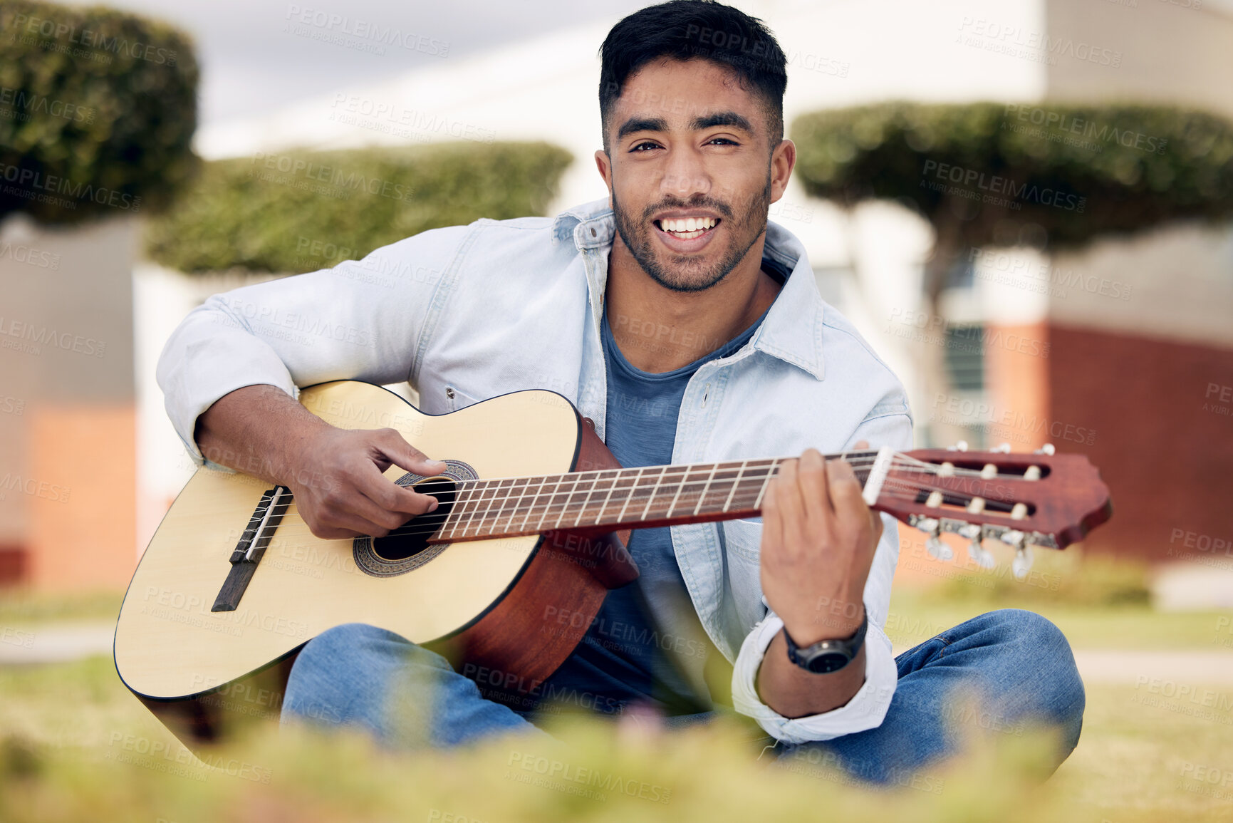 Buy stock photo Music, portrait and man playing guitar outdoor in garden to compose, practice or relax in summer. Art, face or smile and happy guitarist or musician with instrument in park for talent or passion