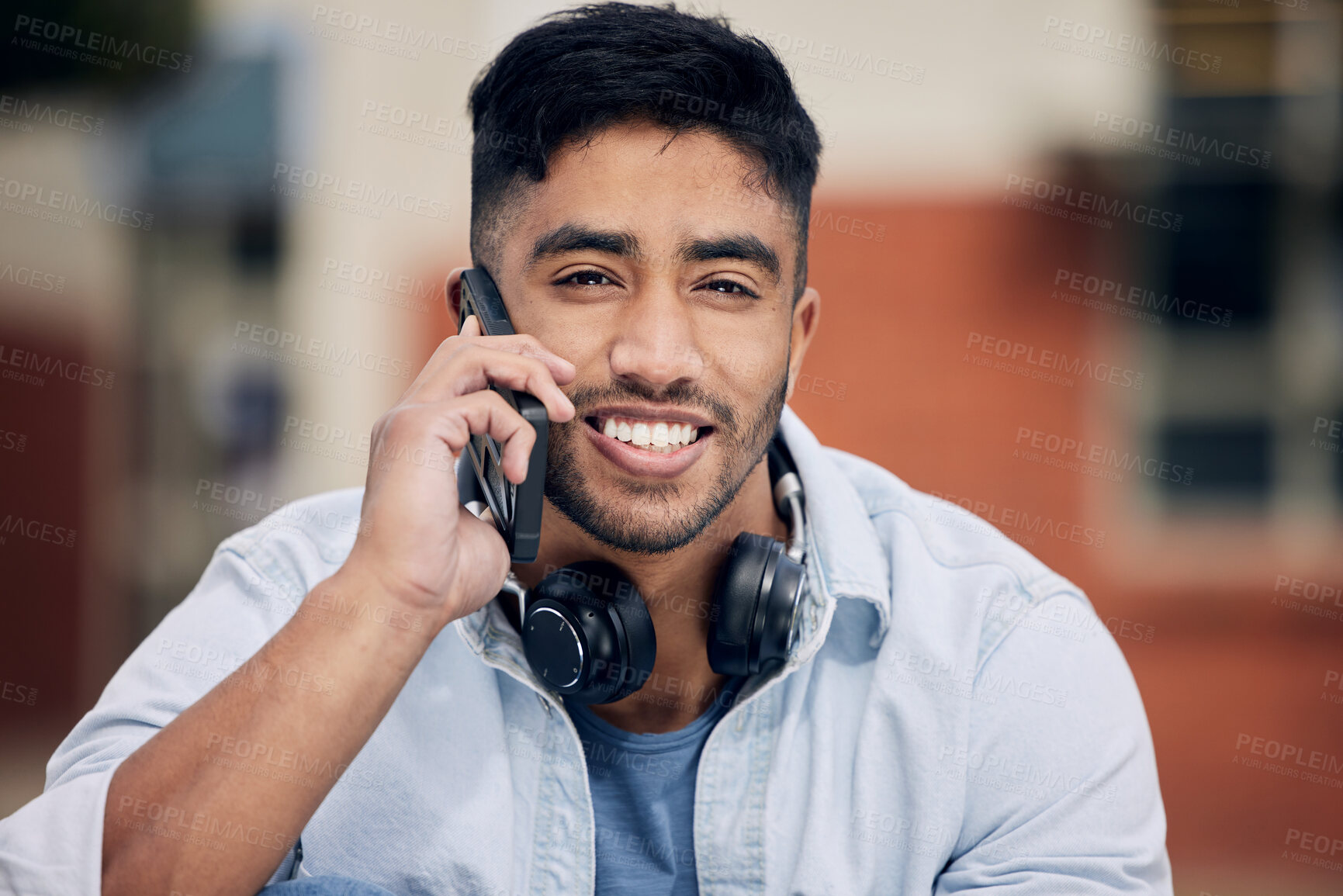 Buy stock photo Happy man, portrait and students with phone call for discussion or friendly chat with headphones at college. Young male person or learner with smile on mobile smartphone for conversation at campus