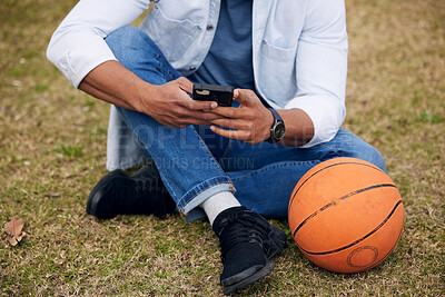 Buy stock photo Man, hands and phone with basketball on grass field for communication, social media or news at park. Closeup of male person or sports player chatting on mobile smartphone for online texting or app