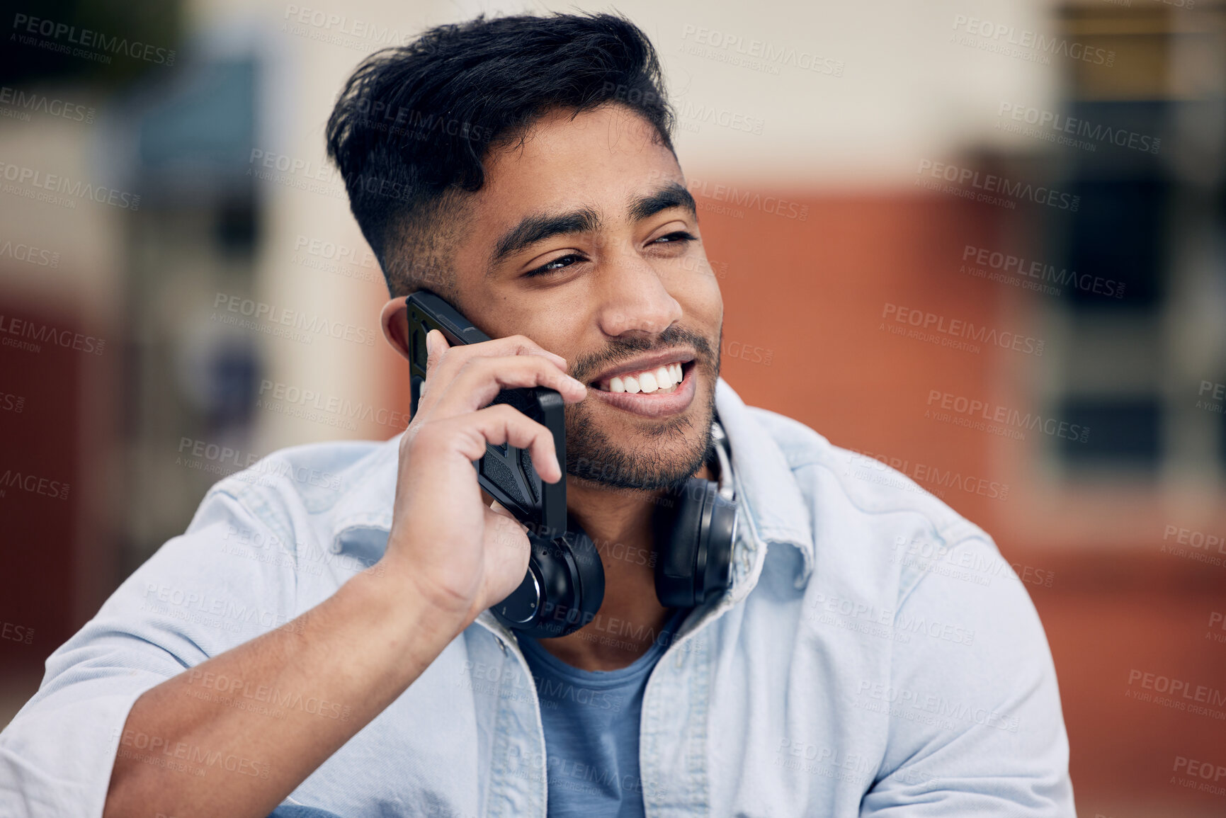 Buy stock photo Happy man, student and discussion with phone call at college for friendly chat or outdoor talk. Male person or learner with smile or headphones on mobile smartphone for online conversation on campus