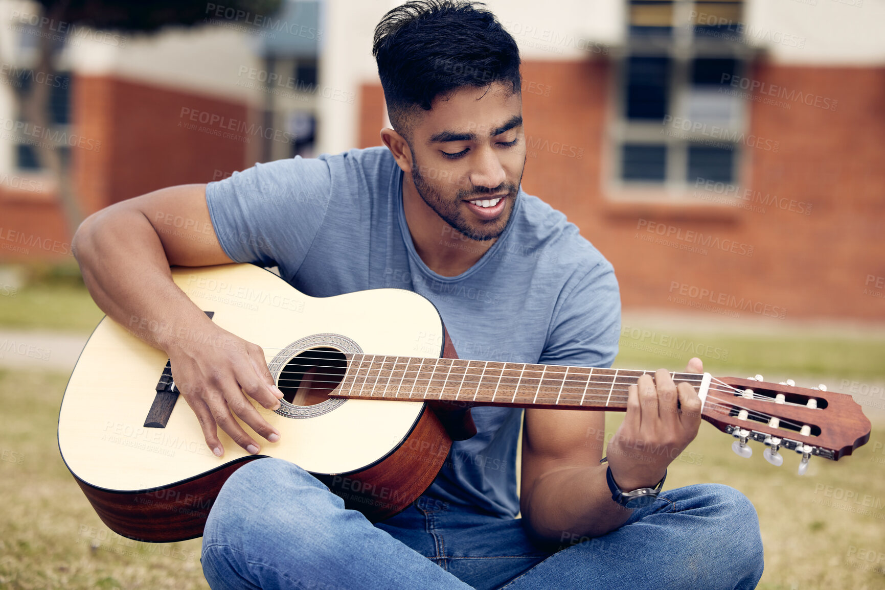 Buy stock photo Man, smile and guitar in garden for music, sound and performance in nature. Male person, musician and playing instrument on lawn at university for practice, production and outdoor show rehearsal 