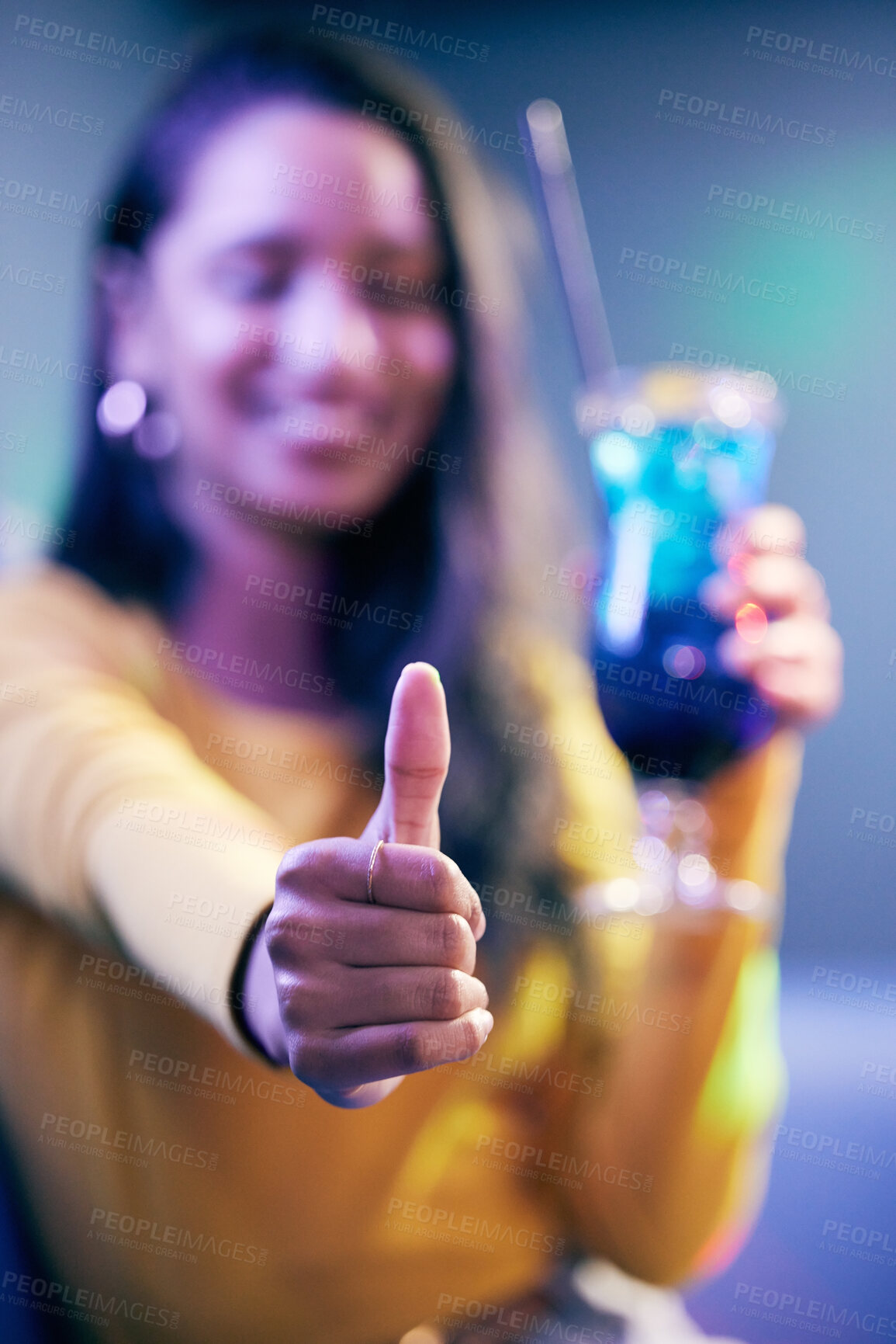 Buy stock photo Woman, glass and thumbs up in party for celebration with cocktail, agreement and good review for nightclub. Female person, alcohol and hand with yes emoji in pub for promote concert and event winner