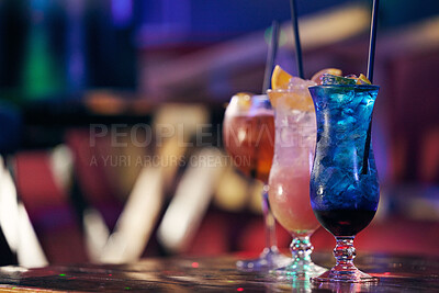 Buy stock photo Shot of three cocktails on a table in a nightclub