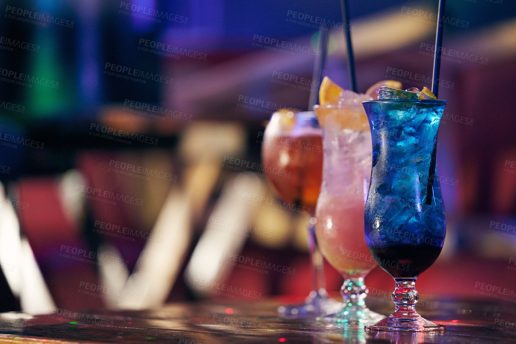 Buy stock photo Cocktails, alcohol beverage and fruit for drink at table in a nightclub for party, event or social gathering. Mixology, mocktail and ice in glass with straw for refreshments to celebrate at pub
