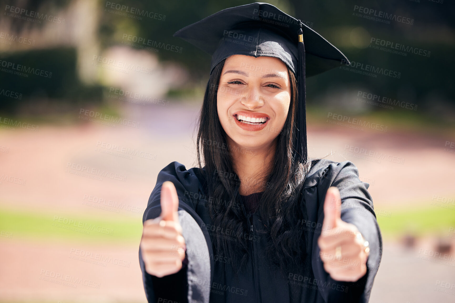 Buy stock photo Woman, portrait and happy with thumbs up for graduation on campus with celebration, success and completion for qualification. Achievement, college and pride with smile or confident with future