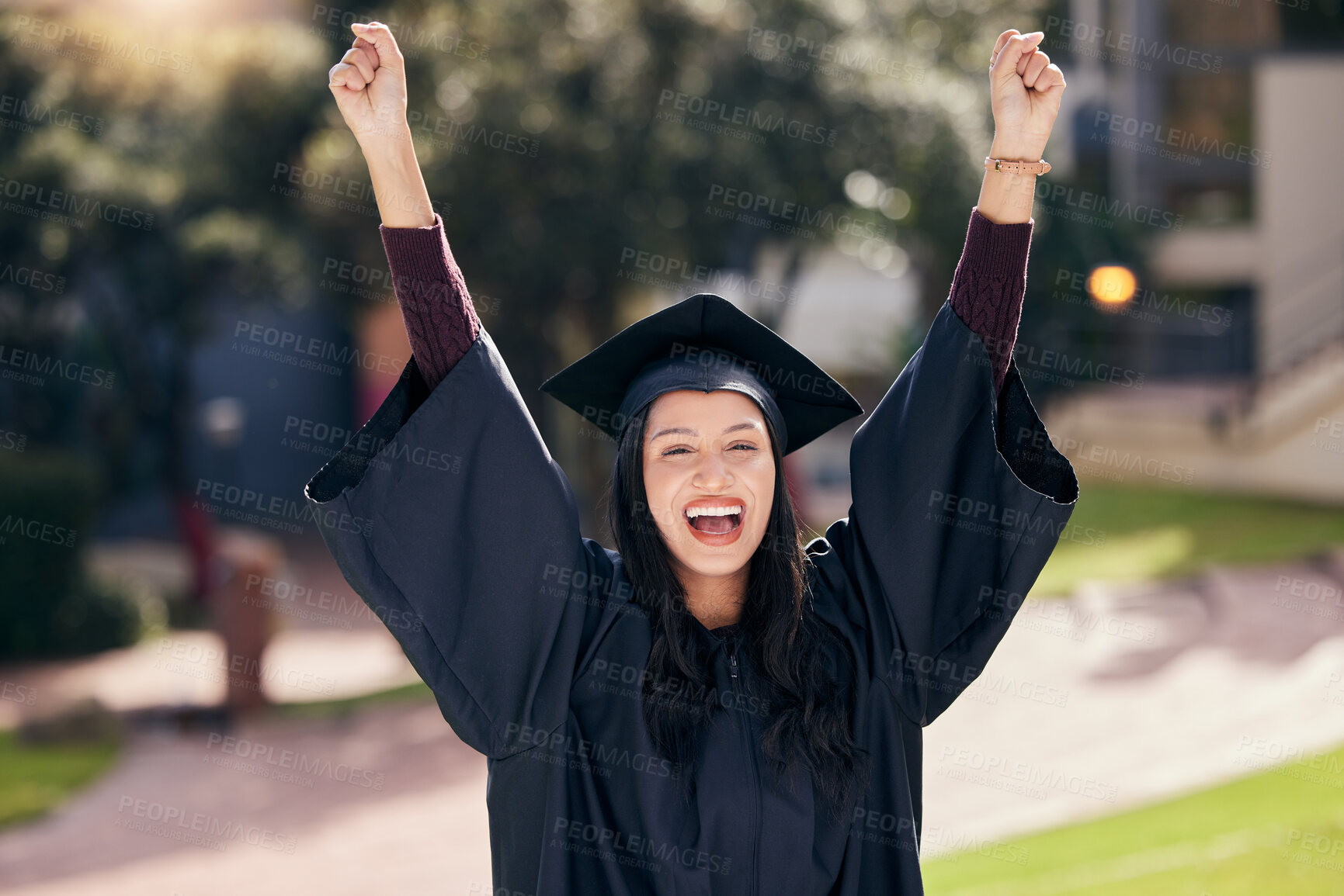 Buy stock photo Woman, portrait and cheerful for university graduation on campus with celebration, success and completion for qualification. Arms up, college and pride with smile or happiness on education or future