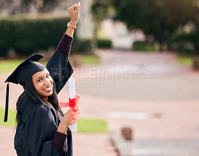 Buy stock photo Cropped portrait of an attractive young female student celebrating on graduation day