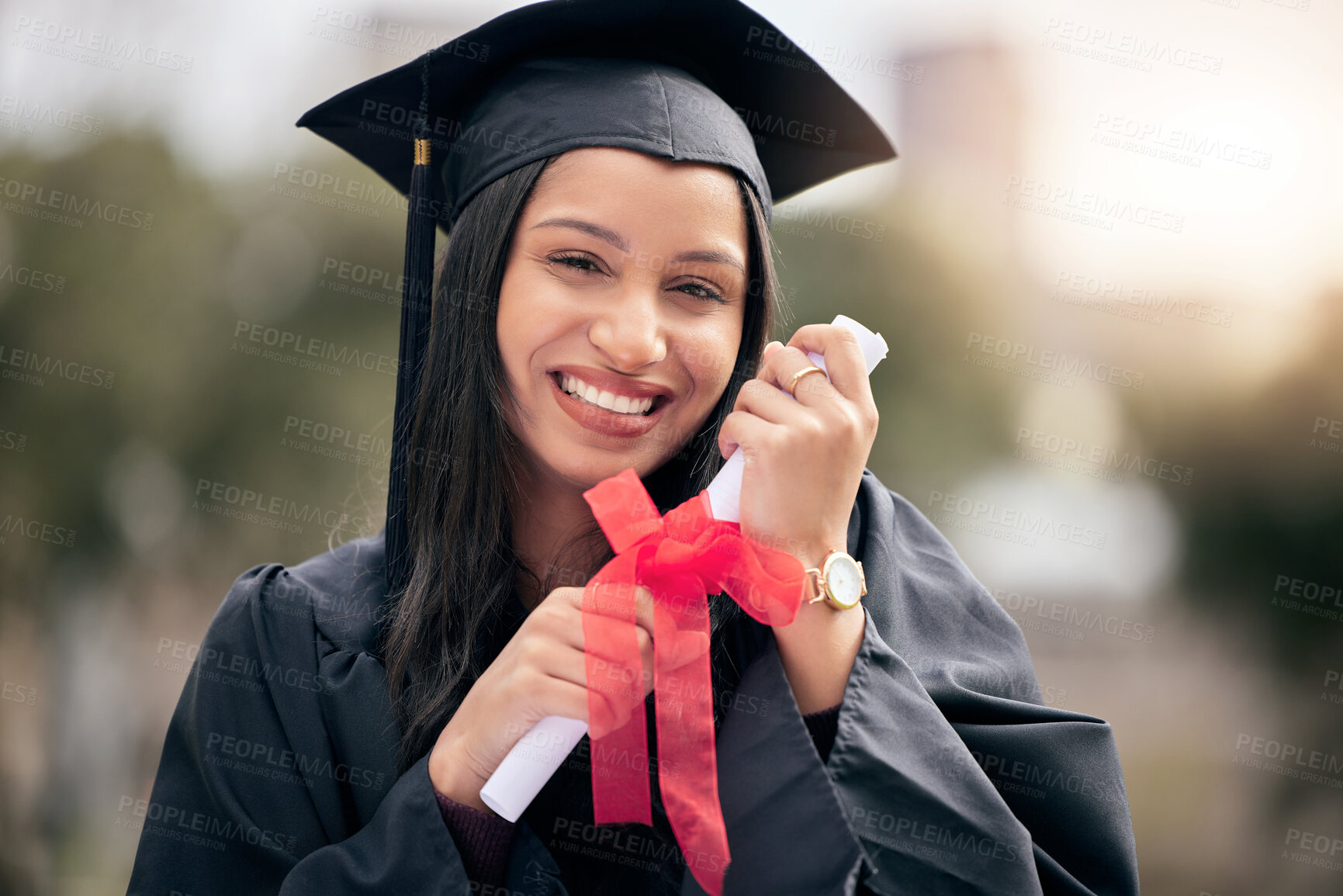 Buy stock photo Cropped portrait of an attractive young female student celebrating on graduation day