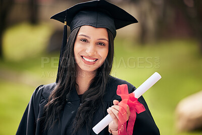 Buy stock photo Cropped portrait of an attractive young female student celebrating on graduation day