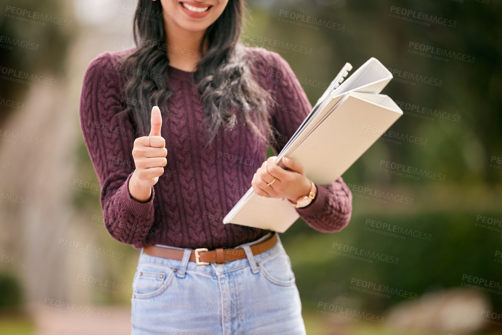 Buy stock photo Portrait, hand and girl with thumbs up, student and winning with support, review and promotion for higher education. Face, person and woman with documents, hand gesture and like emoji with ok sign