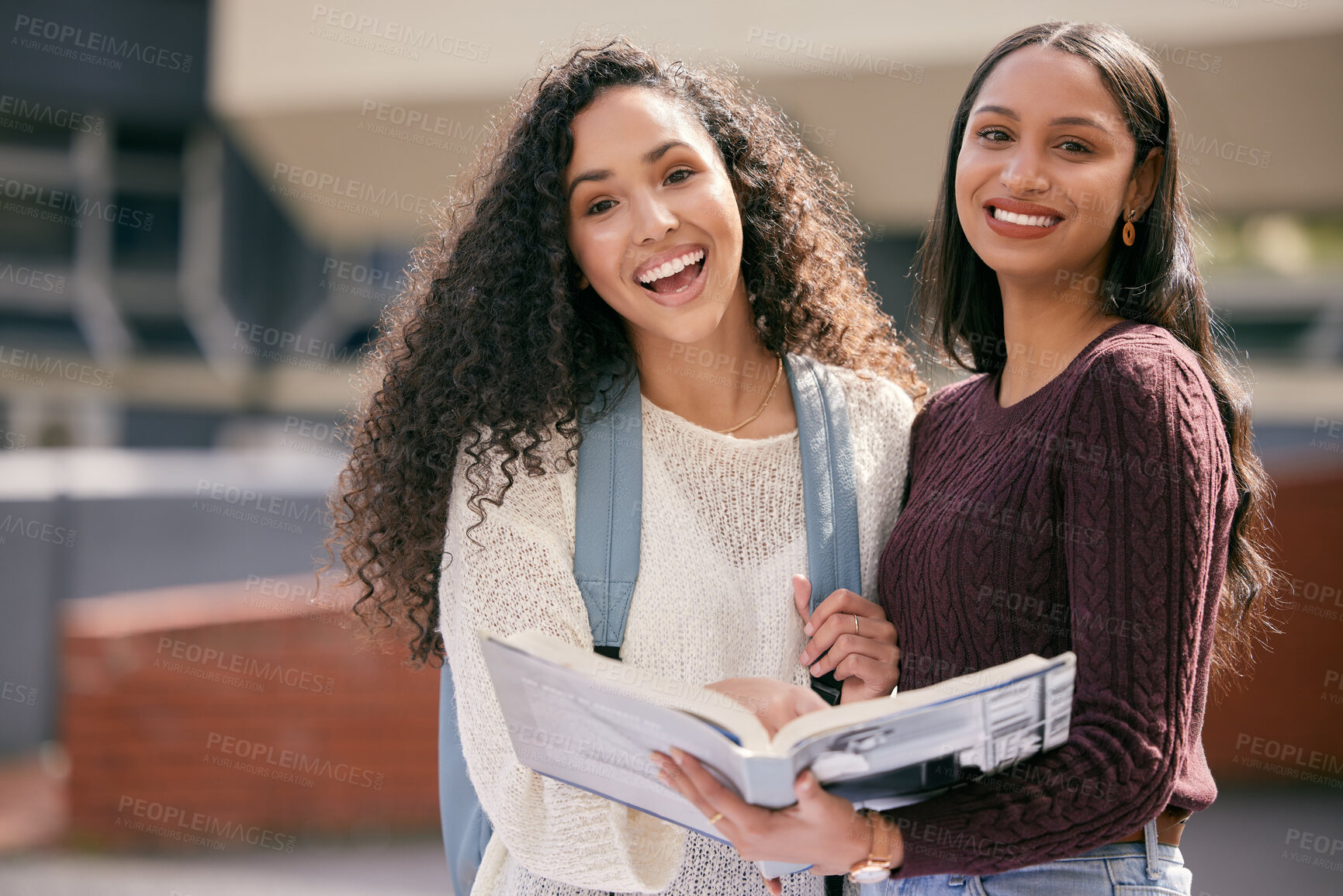 Buy stock photo Book, university and portrait of female students studying for a test outdoor on campus together. Happy, smile and women friends reading information in a textbook for an assignment or exams at college