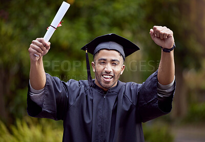 Buy stock photo Shot of a young man looking cheerful on graduation day