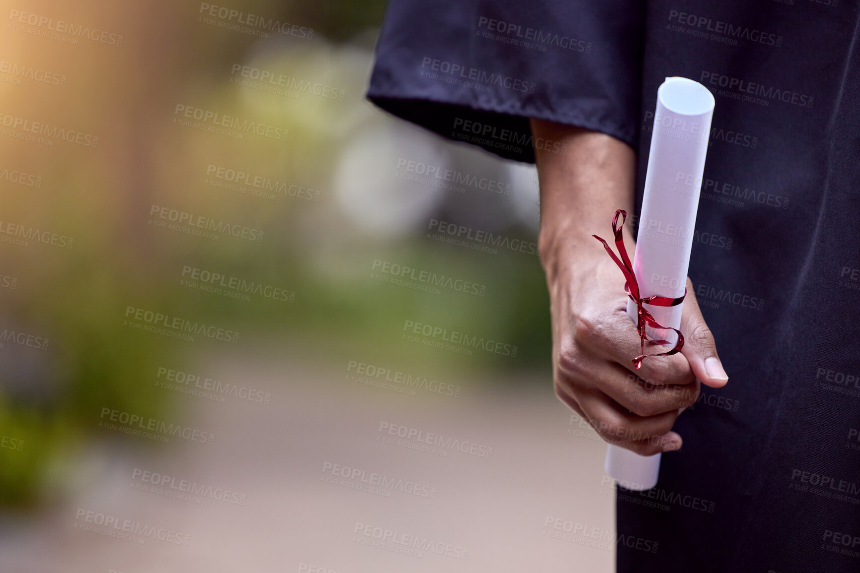 Buy stock photo Graduate, paper or diploma outdoor for celebration, achievement and education ceremony in college. Person, degree or certificate in hand for university event, student success and scholarship award