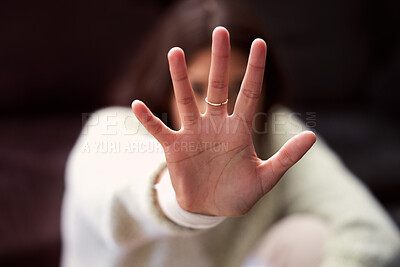 Buy stock photo Shot of a young woman looking distressed and reading out her hand