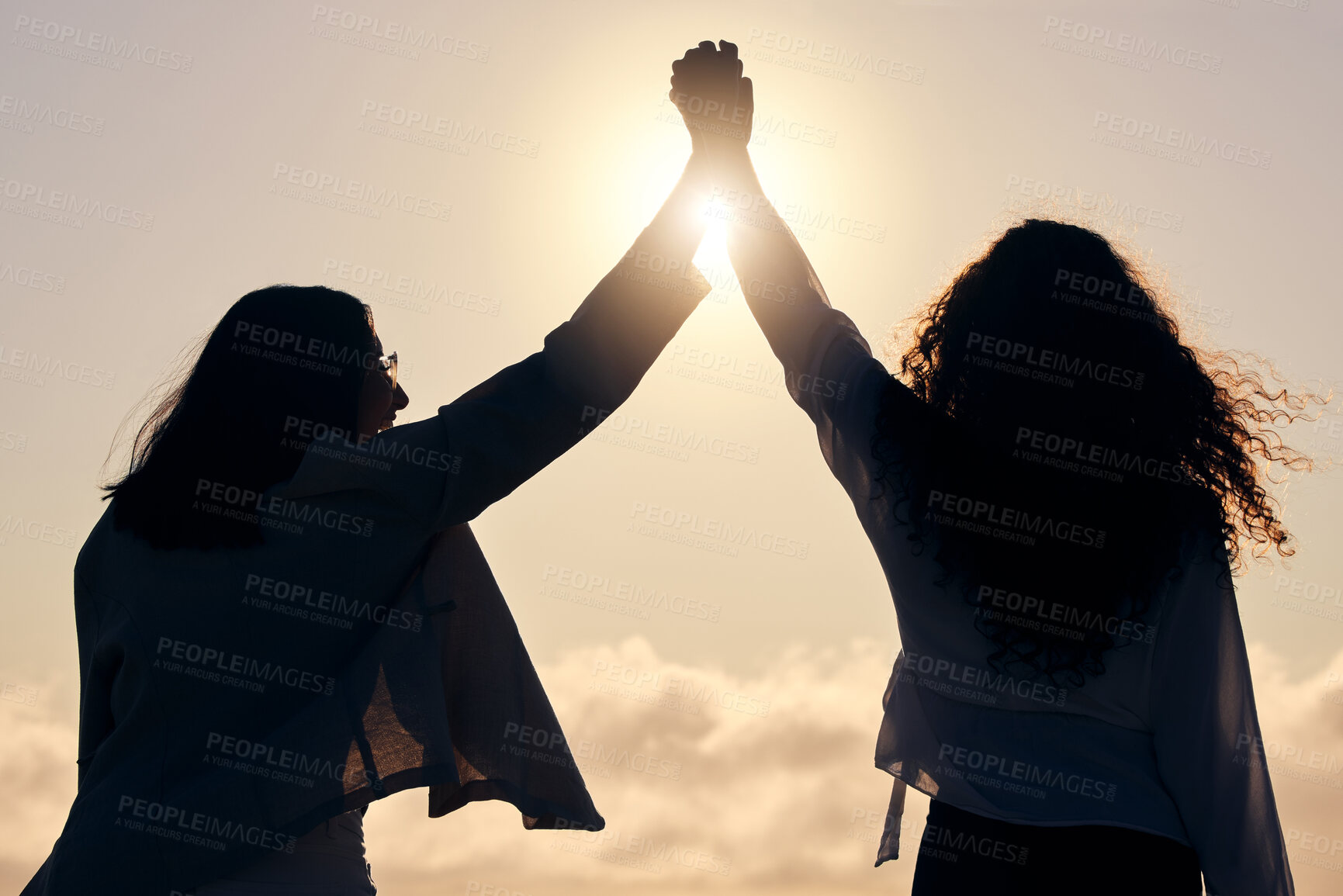 Buy stock photo Back silhouette, sunshine and women holding hands for support, success and love in nature. Happy, dark and friends with solidarity, trust and unity on a holiday for friendship or bonding together
