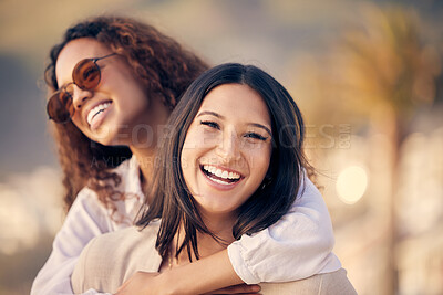 Buy stock photo Shot of two young women spending time together outdoors