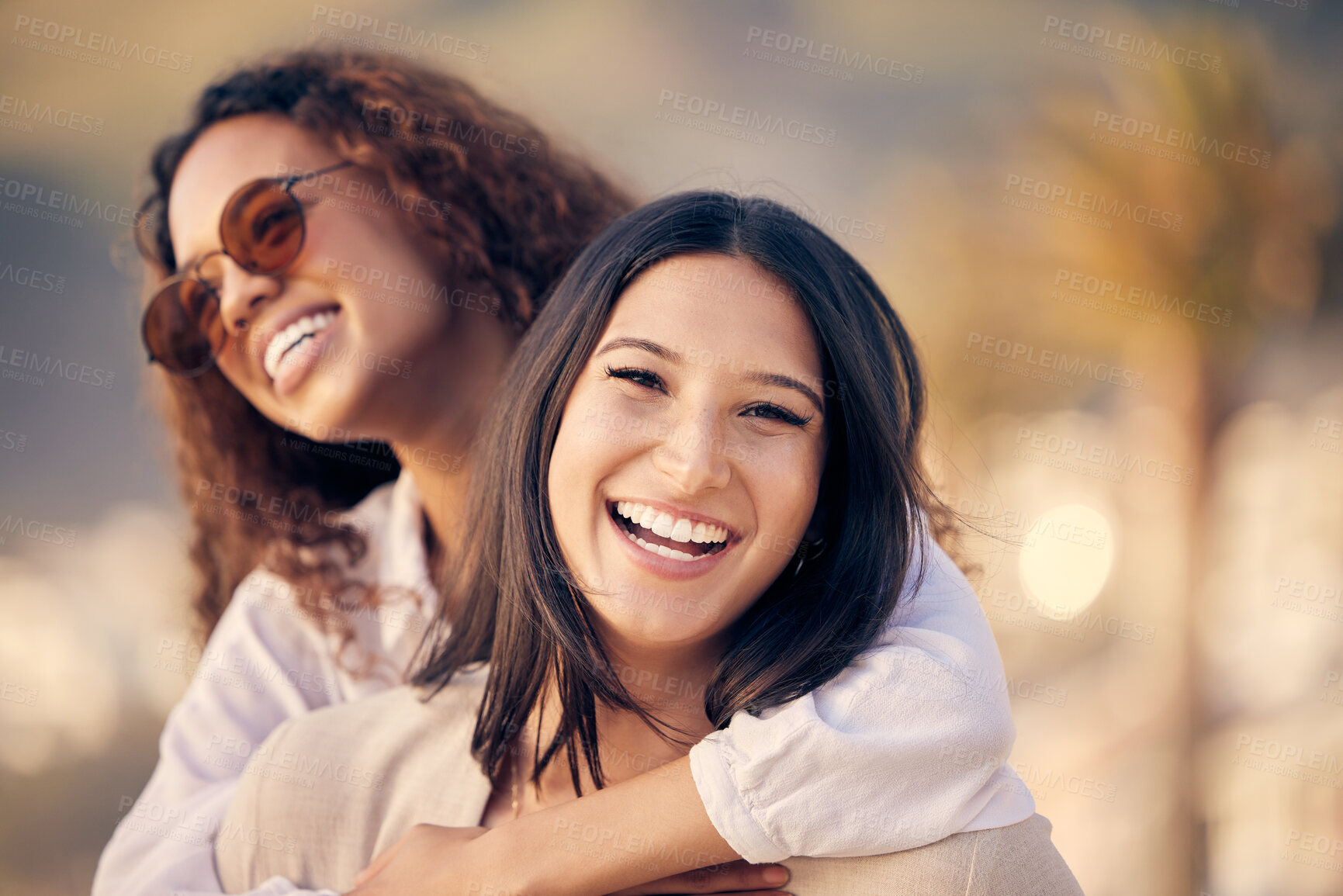 Buy stock photo Lesbian, piggyback and laugh in outdoor portrait, travel and comedy for bonding or funny humor. Couple, carry game and embrace in nature on vacation or holiday, romance and lgbtq marriage on trip