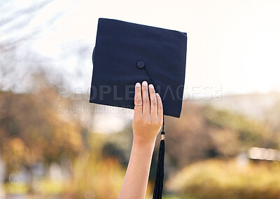 Buy stock photo Shot of an unrecognisable woman holding her graduation cap at university