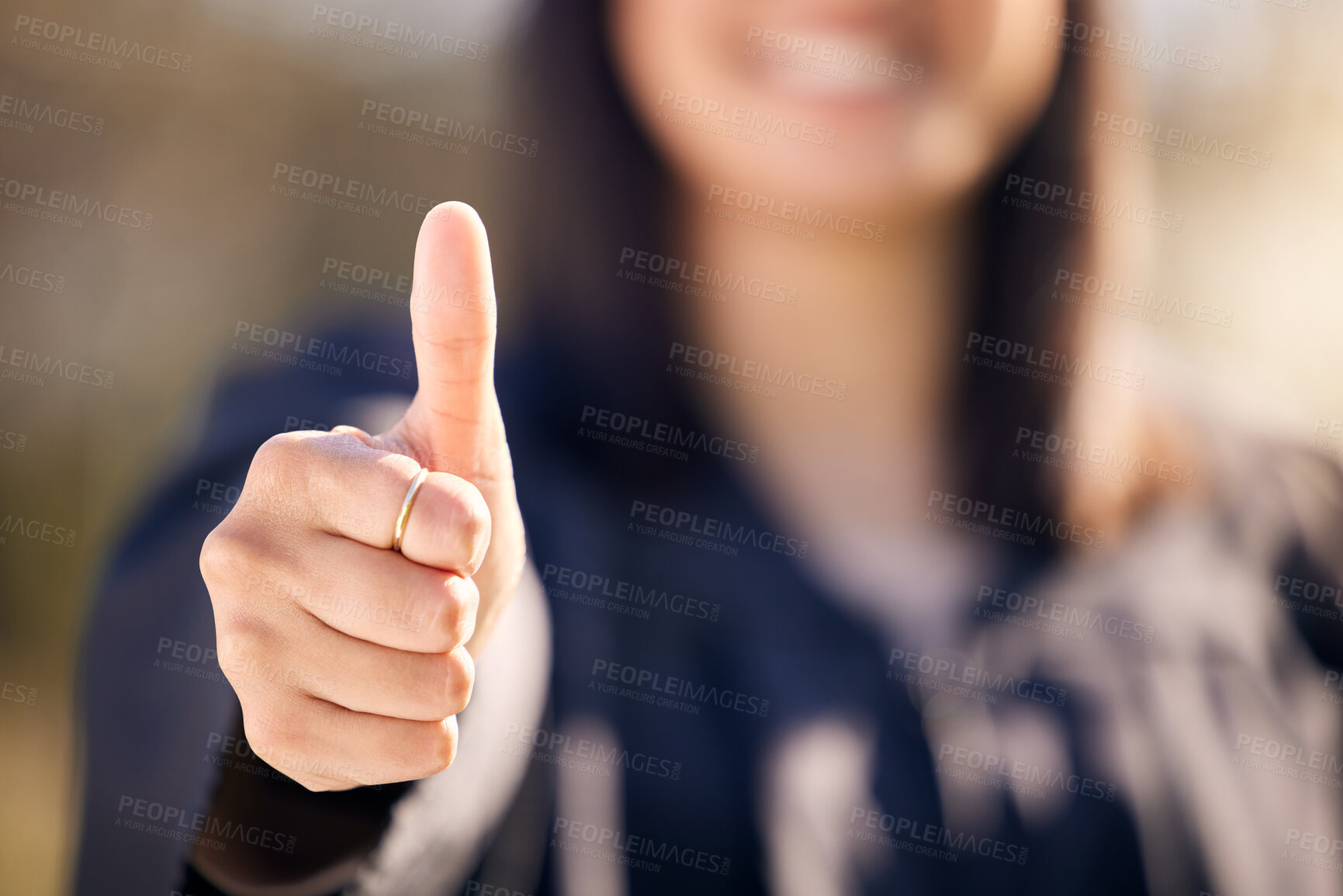 Buy stock photo Thumbs up, celebration and woman outdoor for graduation with knowledge, scholarship and support for college. Female graduate, goals and hand with yes emoji in campus for promote education and success