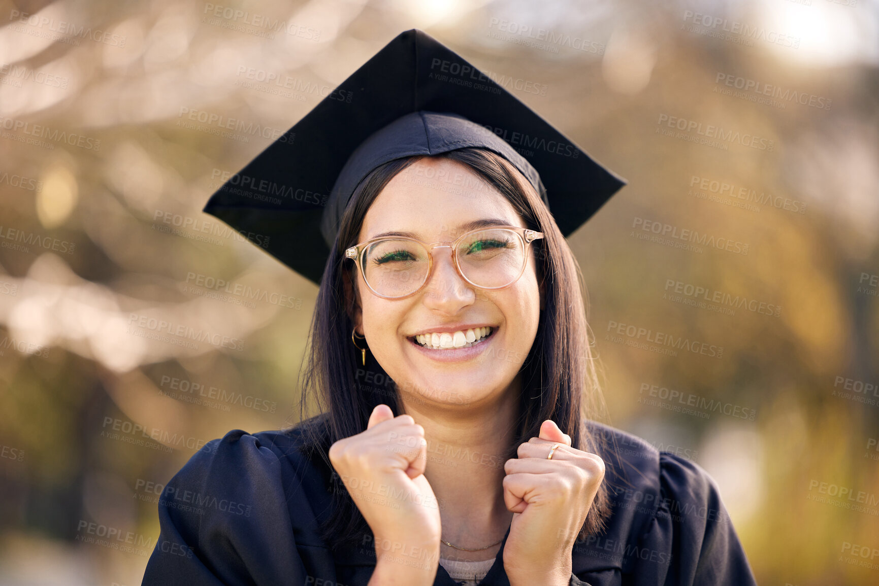 Buy stock photo Shot of a young woman cheering on graduation day