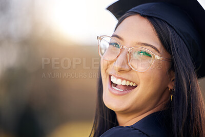 Buy stock photo Shot of a happy young woman celebrating graduation day