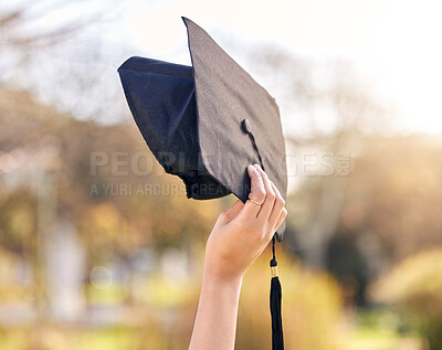 Buy stock photo Shot of an unrecognisable woman holding her graduation at university