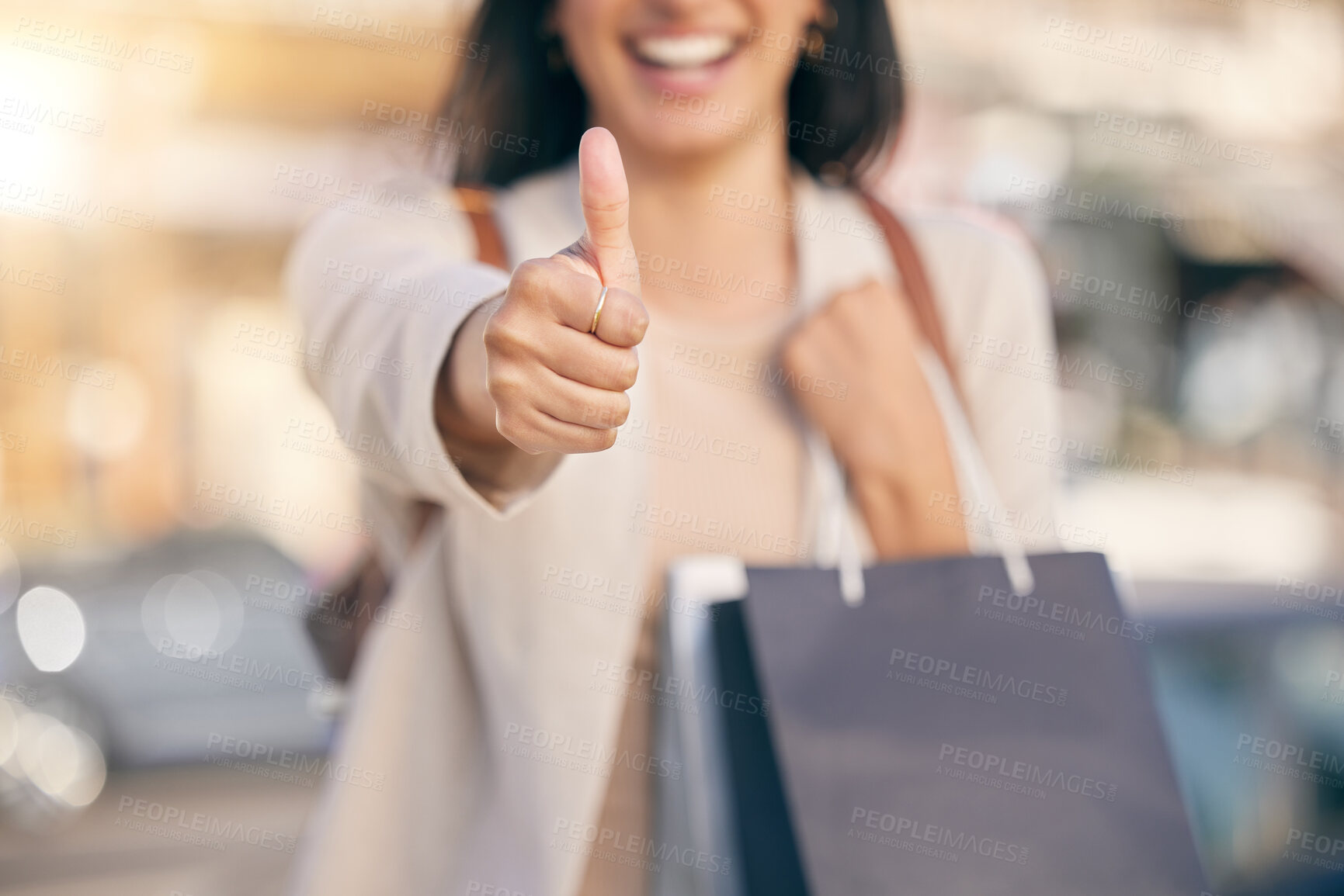 Buy stock photo Woman, hand and shopping with thumbs up in city for deal, discount or sale in New York. Closeup, customer and emoji sign for yes at boutique and like luxury store, fashion or success in purchase