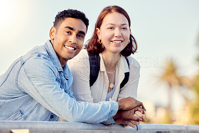 Buy stock photo Shot of a young couple exploring a city together