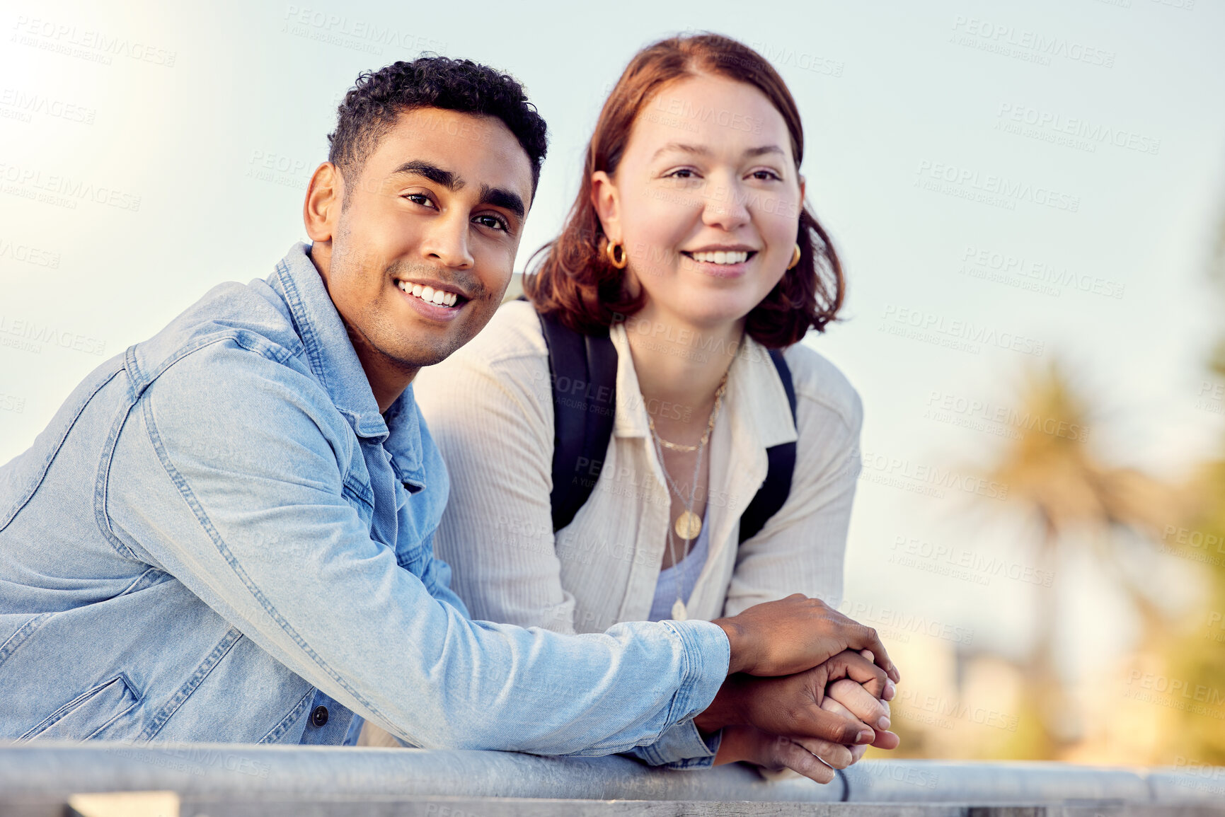 Buy stock photo Shot of a young couple exploring a city together