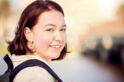 Buy stock photo Shot of a beautiful young woman out in the city