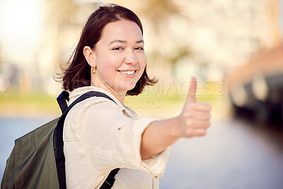 Buy stock photo Portrait, tourist or happy woman in city with thumbs up for travel, good news or like for hiking on street road. Positive, hand gesture or girl with thank you smile, yes sign or vote for okay review