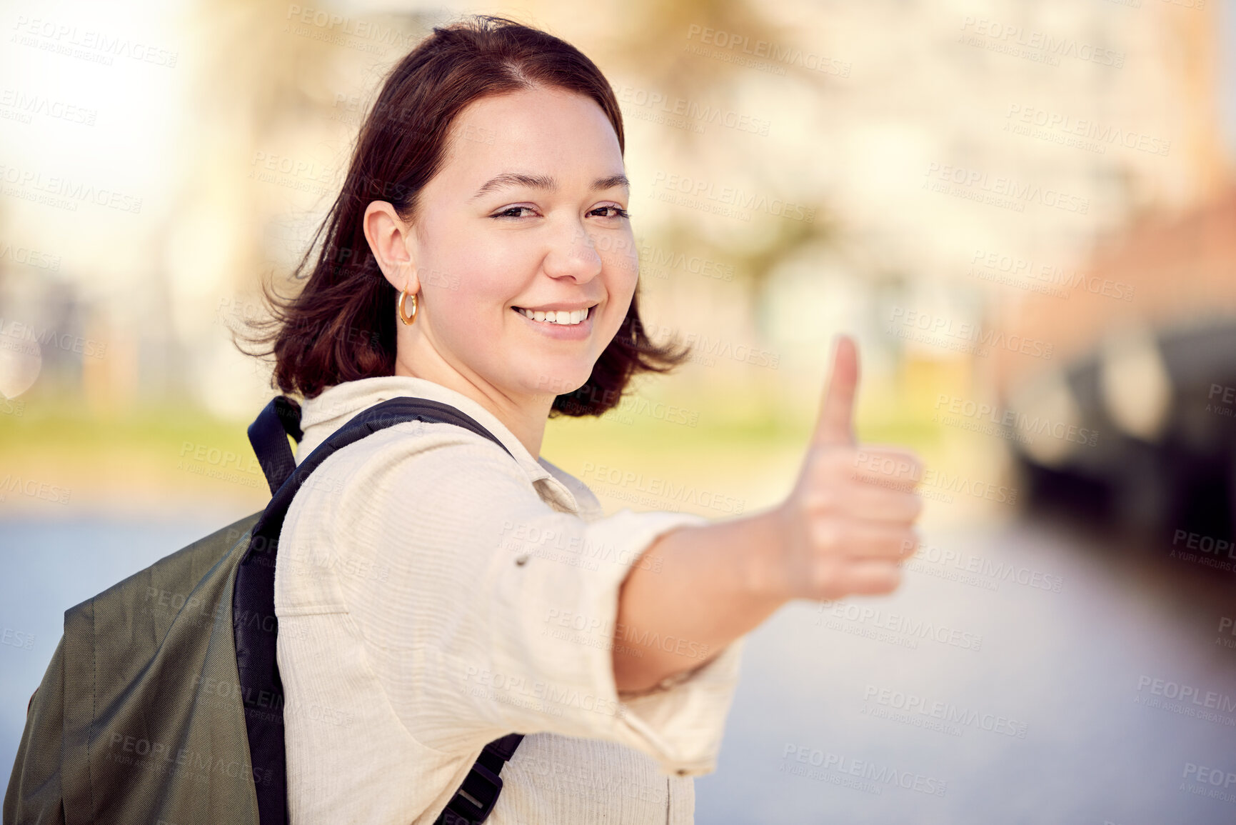 Buy stock photo Portrait, tourist or happy woman in city with thumbs up for travel, good news or like for hiking on street road. Positive, hand gesture or girl with thank you smile, yes sign or vote for okay review