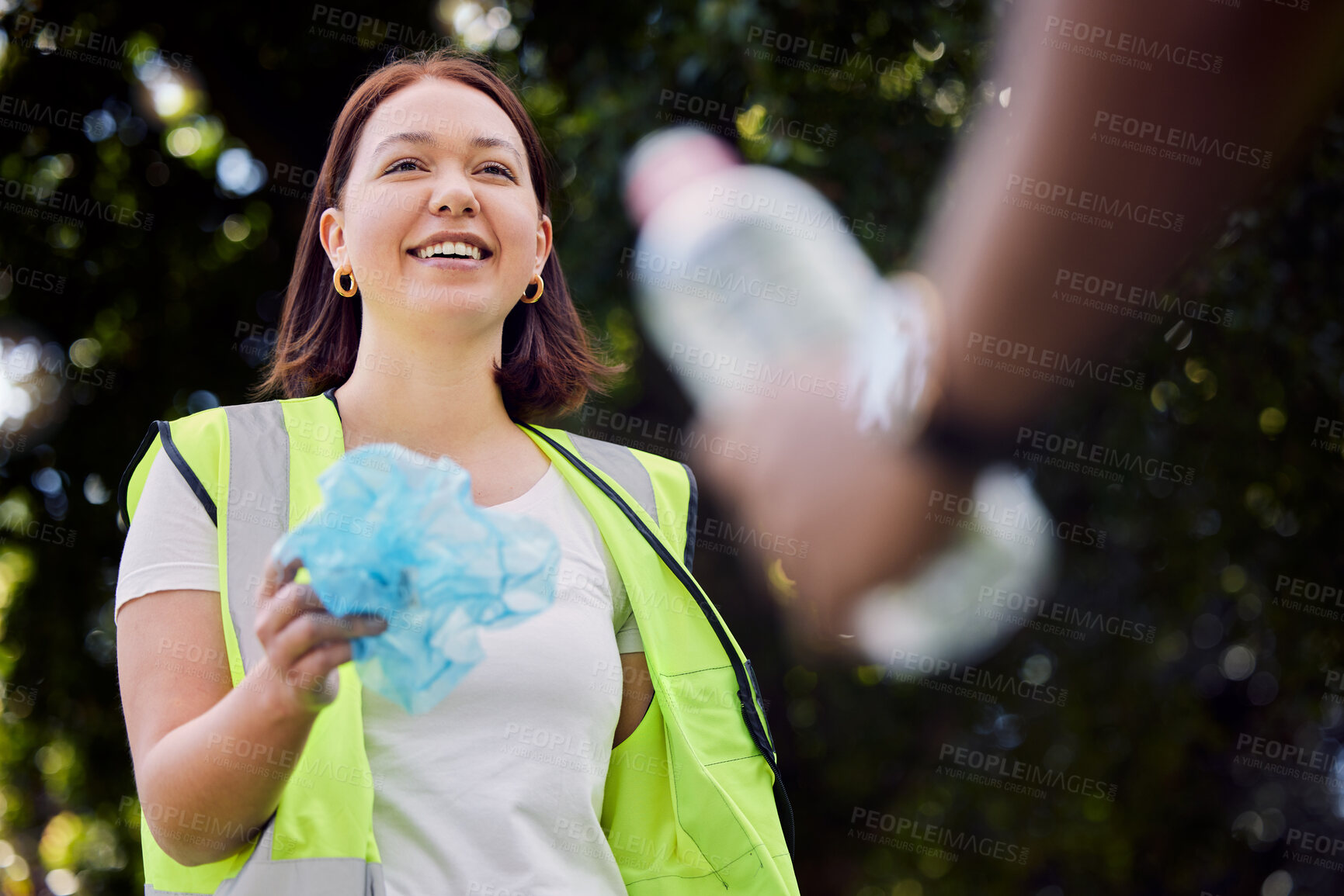 Buy stock photo Volunteer, hands and bottle or happy while cleaning park, support and recycle for climate change or earth day project. People, charity or dirt with eco friendly action, service and sustainability